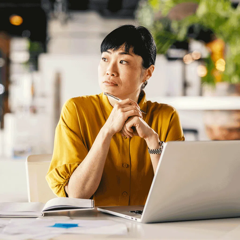 woman looking worried and distracted at work