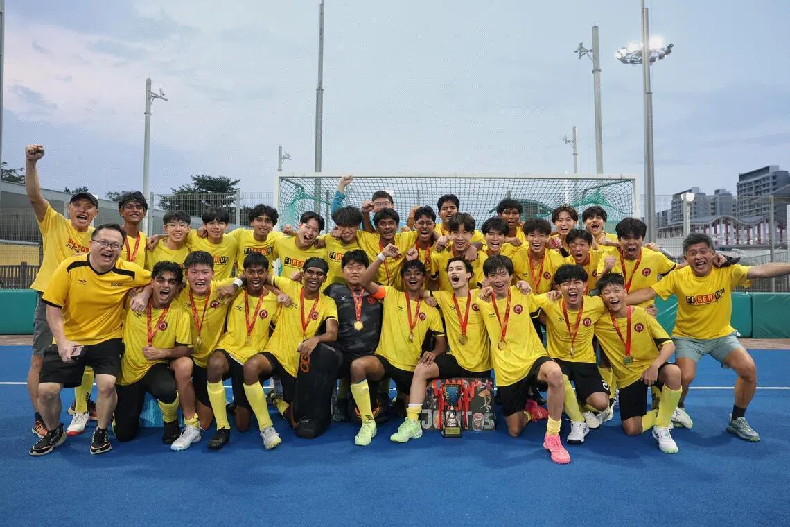 Players and staff from Victoria Junior College celebrate after winning the National School Games A Division Boys' Hockey Finals held at Sengkang Hockey Stadium on May 20, 2026.