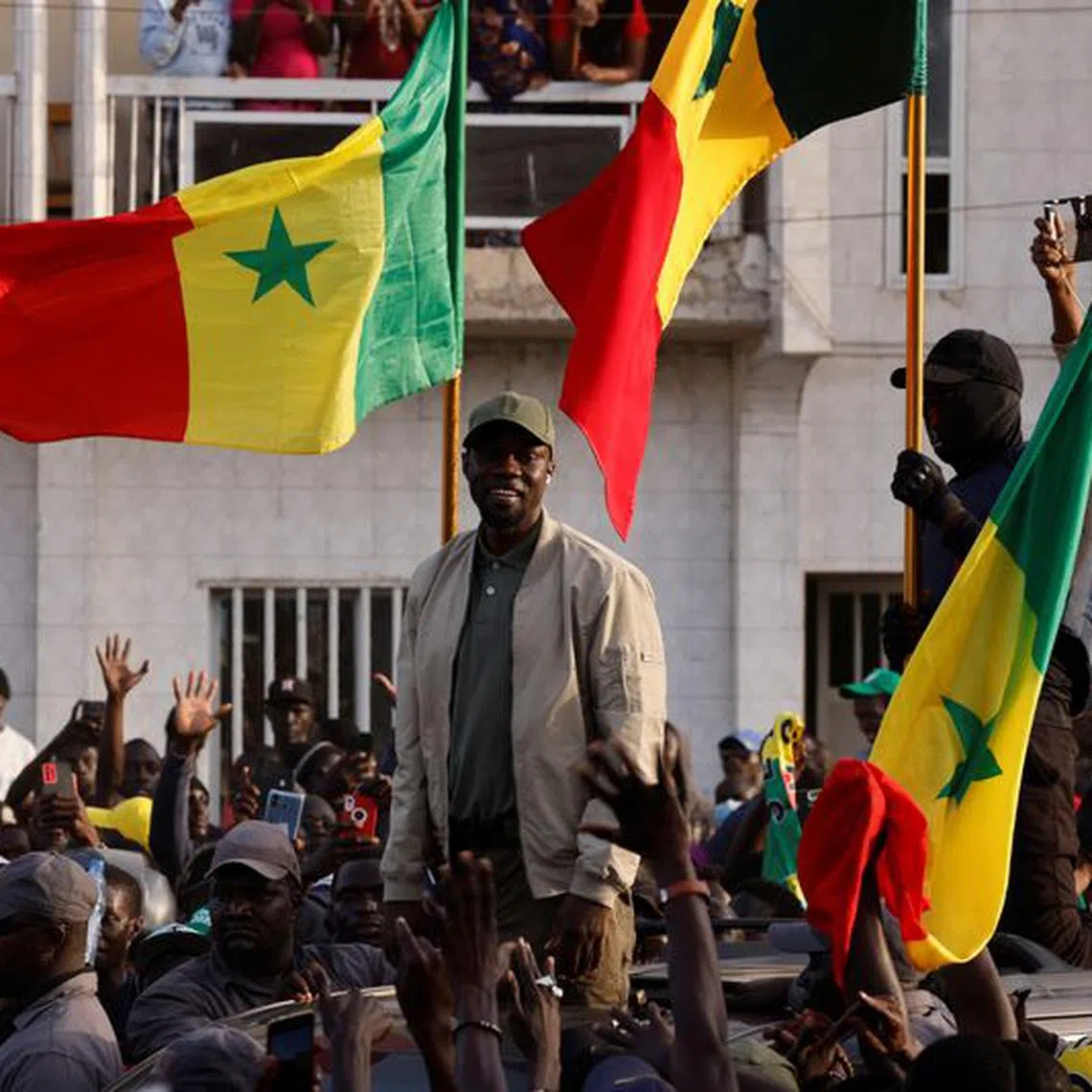 Senegalese opposition leader Ousmane Sonko greets his supporters as he arrives to attend the protest to demand the release of alleged political prisoners ahead of his court appearance on Thursday on libel charges, in Dakar, Senegal March 14, 2023. REUTERS/Zohra Bensemra/File Photo
