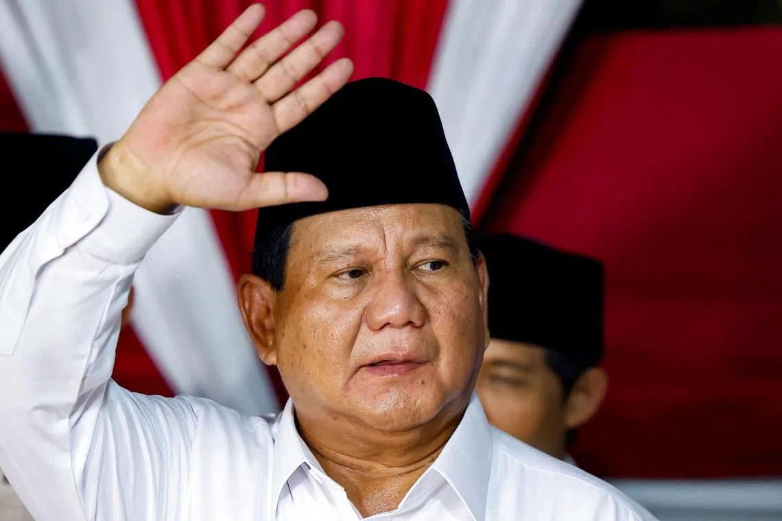 Indonesia's front-runner presidential candidate and Defence Minister Prabowo Subianto waves as he delivers his speech after the country's election commission announced last month's presidential election result, in Jakarta, Indonesia, March 20, 2024. REUTERS/Willy Kurniawan/File Photo