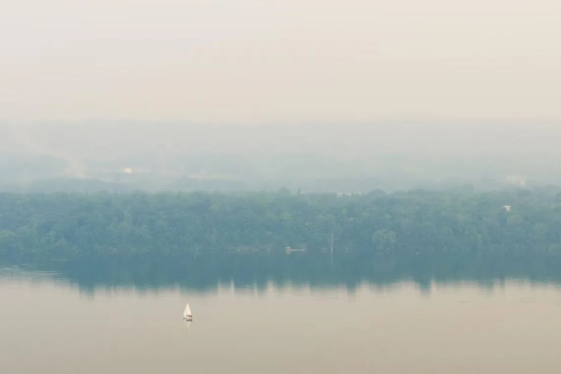Wildfire smoke fills the air around Hamilton, Ontario, Canada July 15, 2026 in a drone photograph. REUTERS/Carlos Osori TPX IMAGES OF THE DAY