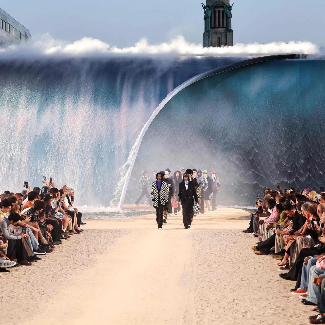 The 8m high wave formed the backdrop to singer-songwriter Pharrell Williams’ 2027 spring-summer show.