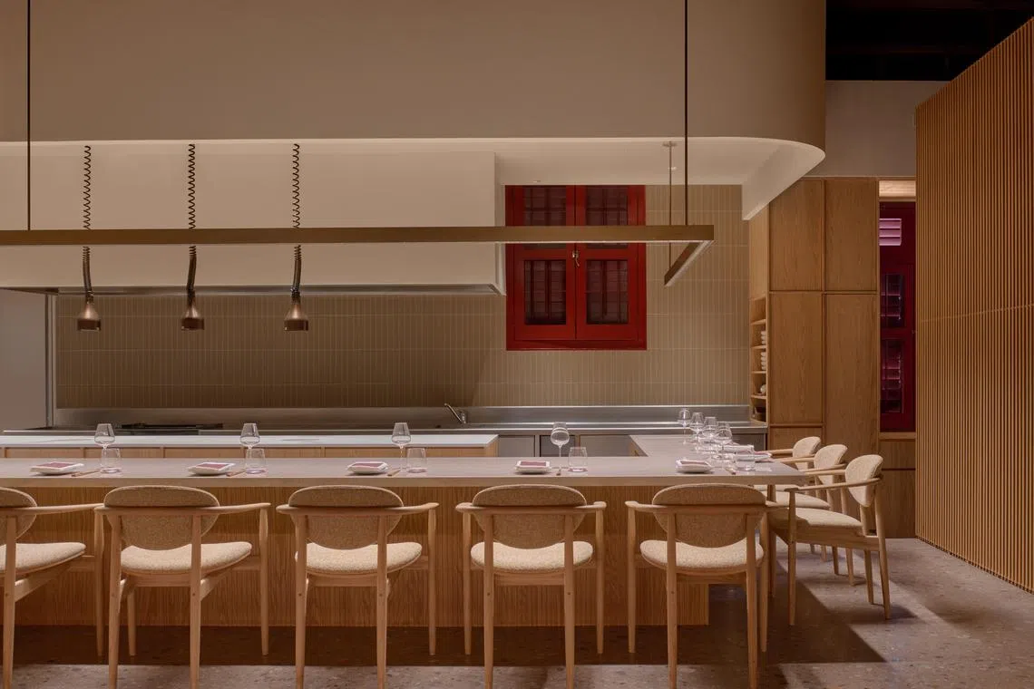 Solo diners are seated at the counter at Loca Niru.