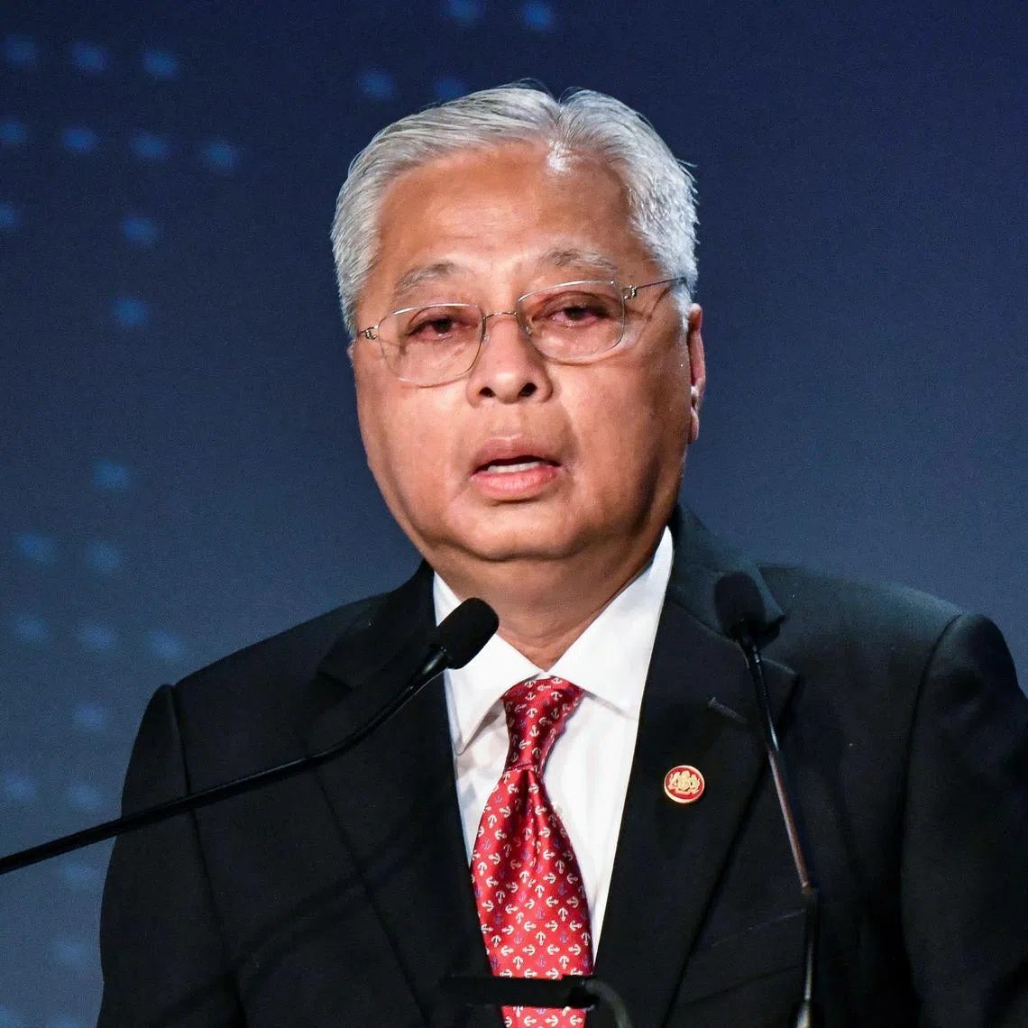 (FILES) In this file photo taken on May 26, 2022 Malaysia's Prime Minister Ismail Sabri Yaakob delivers a speech as part the 27th International Conference on The Future of Asia in Tokyo. - Ismail, a politician with a colourless personality, became prime minister in August 2021 with a thin parliamentary majority following the resignation of his predecessor after a political crisis. (Photo by Kazuhiro NOGI / AFP)