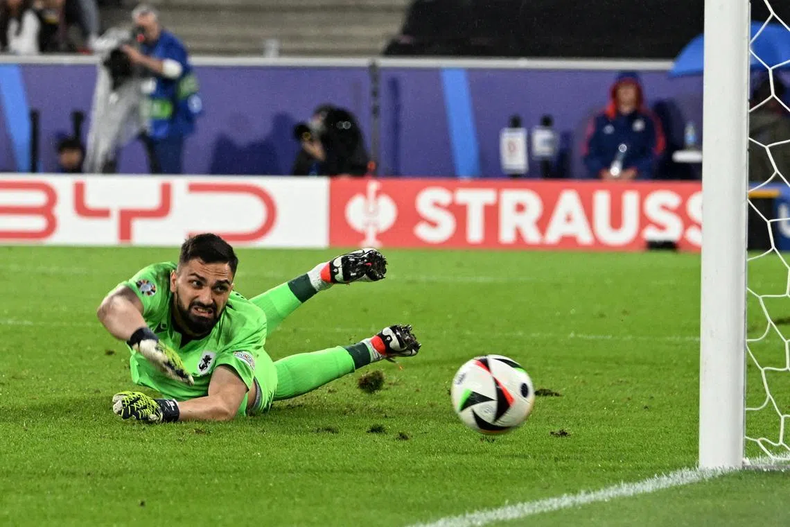 FILE PHOTO: Soccer Football - Euro 2024 - Round of 16 - Spain v Georgia - Cologne Stadium, Cologne, Germany - June 30, 2024 Georgia's Giorgi Mamardashvili in action as Spain's Rodri scores their first goal REUTERS/Carmen Jaspersen/File Photo