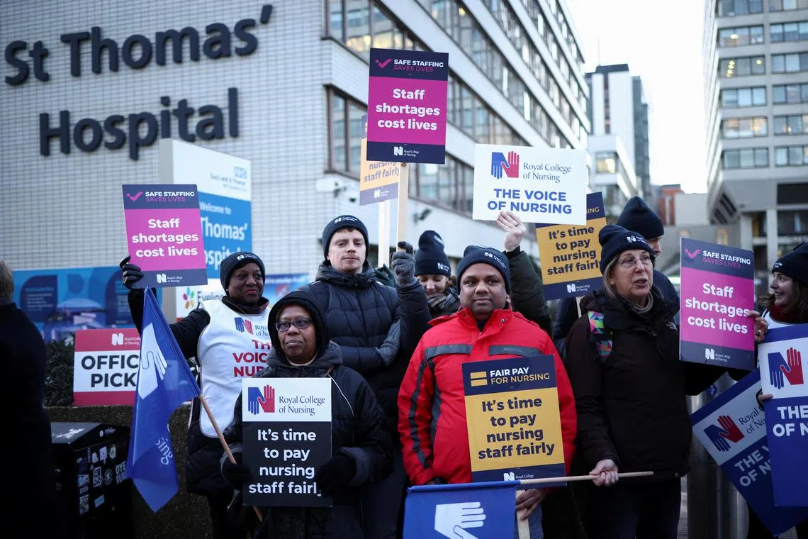 NHS nurses strike outside St Thomas' Hospital in London, Britain, on Dec 15, 2022.