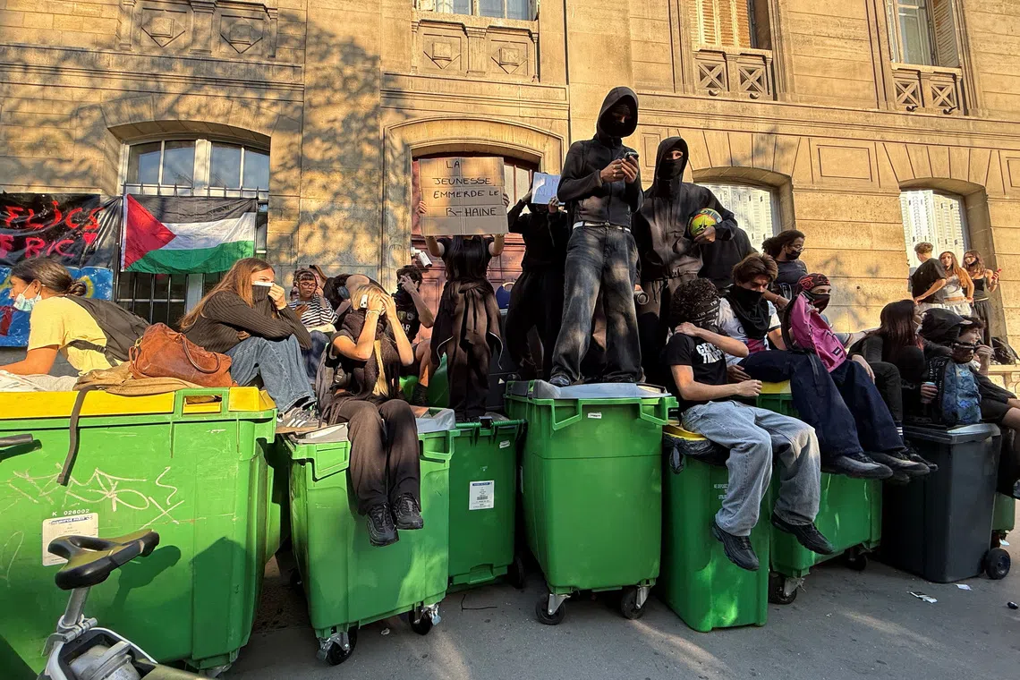 Student protests and French public sector strike heap pressure on Macron
