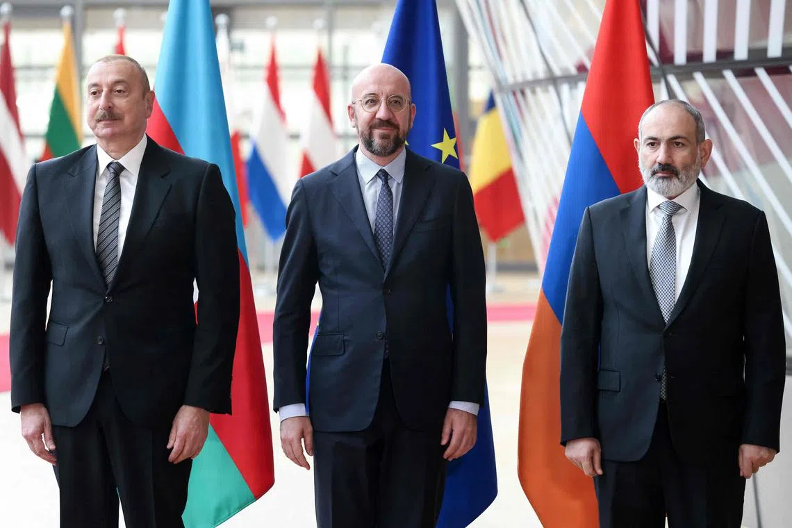 (From left) Azerbaijan's Mr Aliyev, the European Council's Mr Michel and Armenia's Mr Pashinyan at a meeting in Brussels in May 2023.