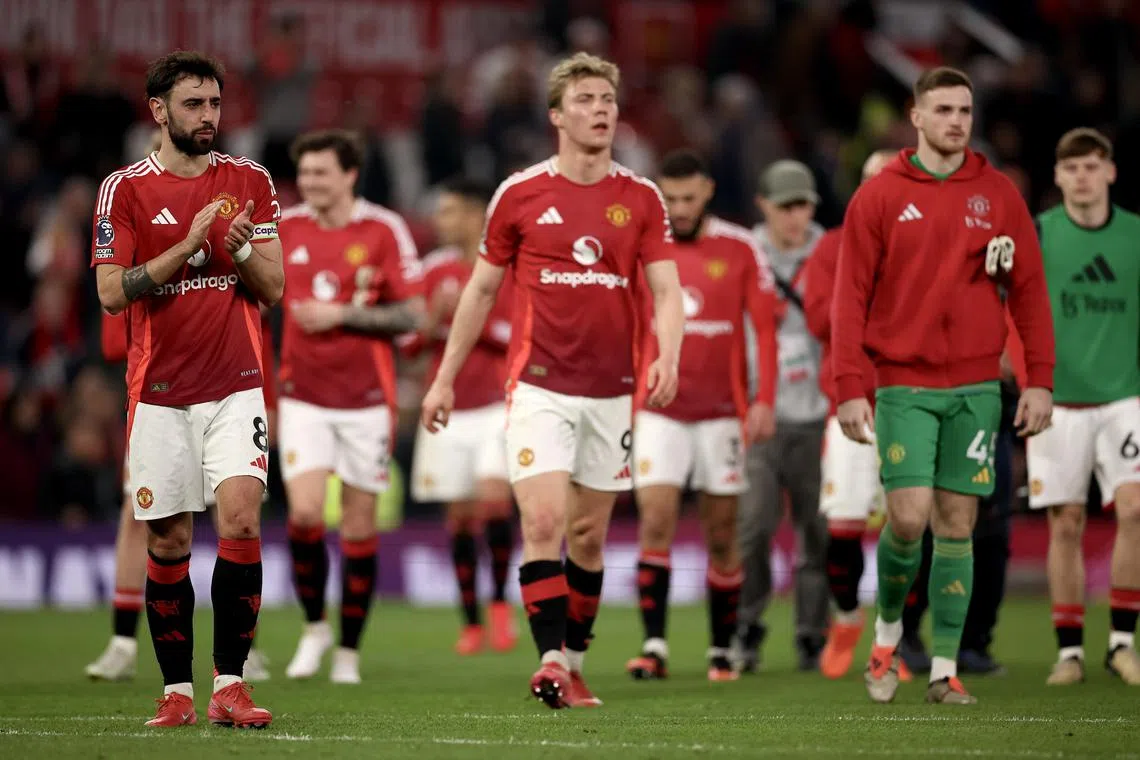 Manchester United players following a 1-1 English Premier League draw with Arsenal.