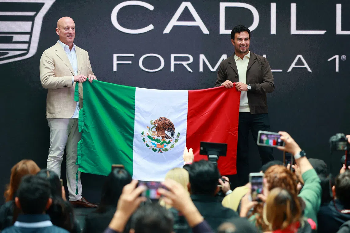 Cadillac F1 team CEO Dan Towriss (left) and Sergio Perez in August.