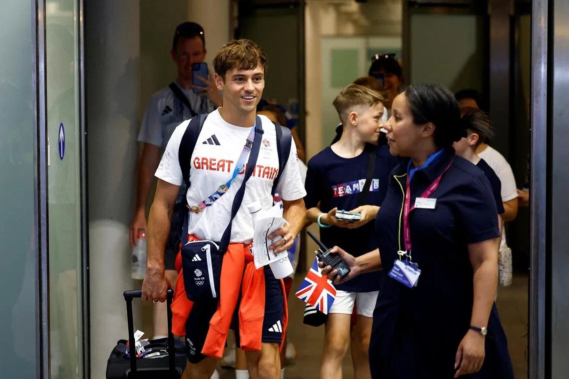 Britain's diving men's synchronised 10m platform silver medallist Tom Daley returns to London at St Pancras station, London, with other Team GB athletes on Aug 12, 2024.