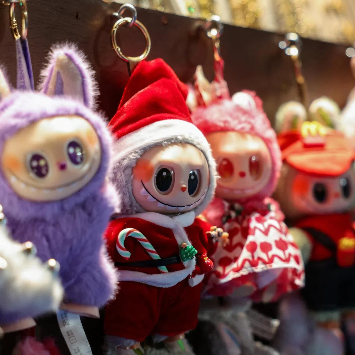 A Labubu in a Santa Claus outfit is displayed for sale at a holiday market in Times Square in Manhattan, New York City, U.S., November 15, 2025. REUTERS/Kylie Cooper