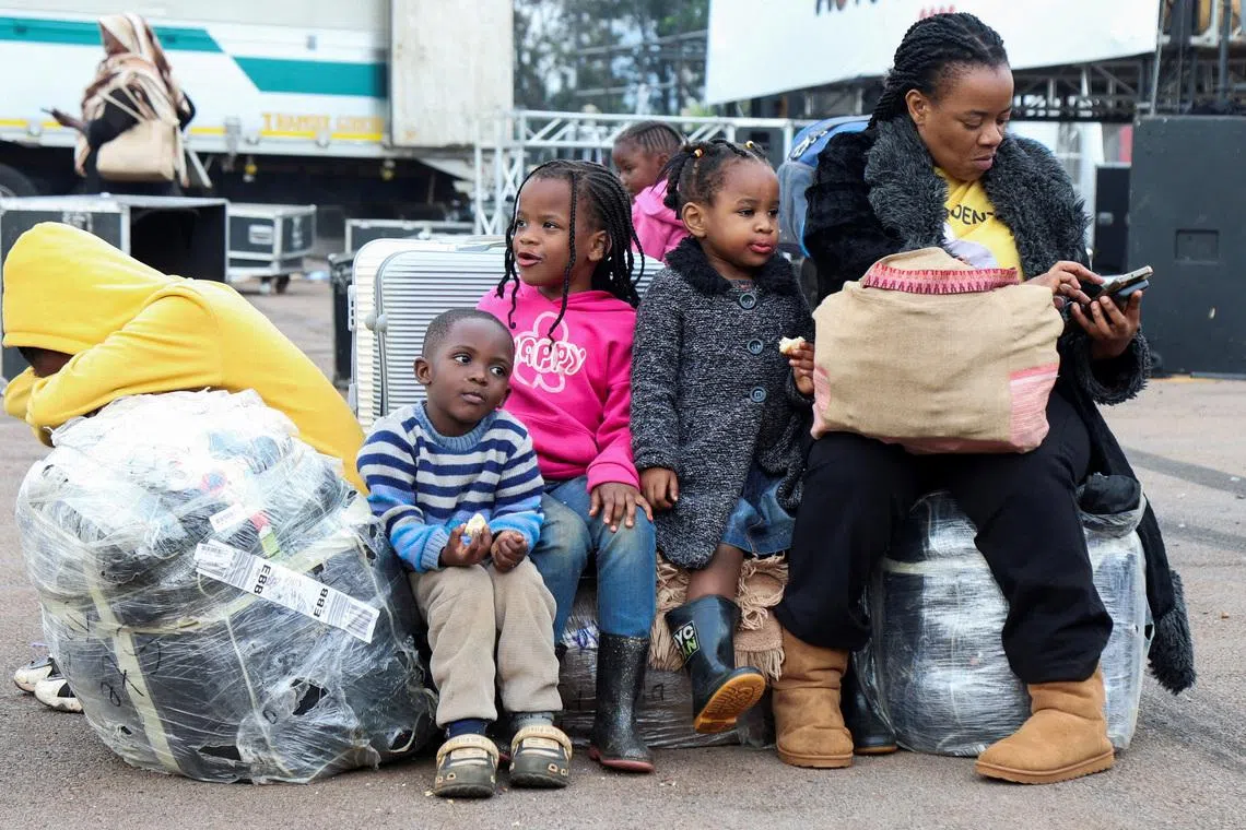 Ugandan nationals gather with their luggage to be documented after arriving, as authorities repatriate citizens fleeing xenophobic attacks in South Africa, at the Kololo ceremonial grounds in Kampala, Uganda, July 20, 2026. REUTERS/Michael Muhati