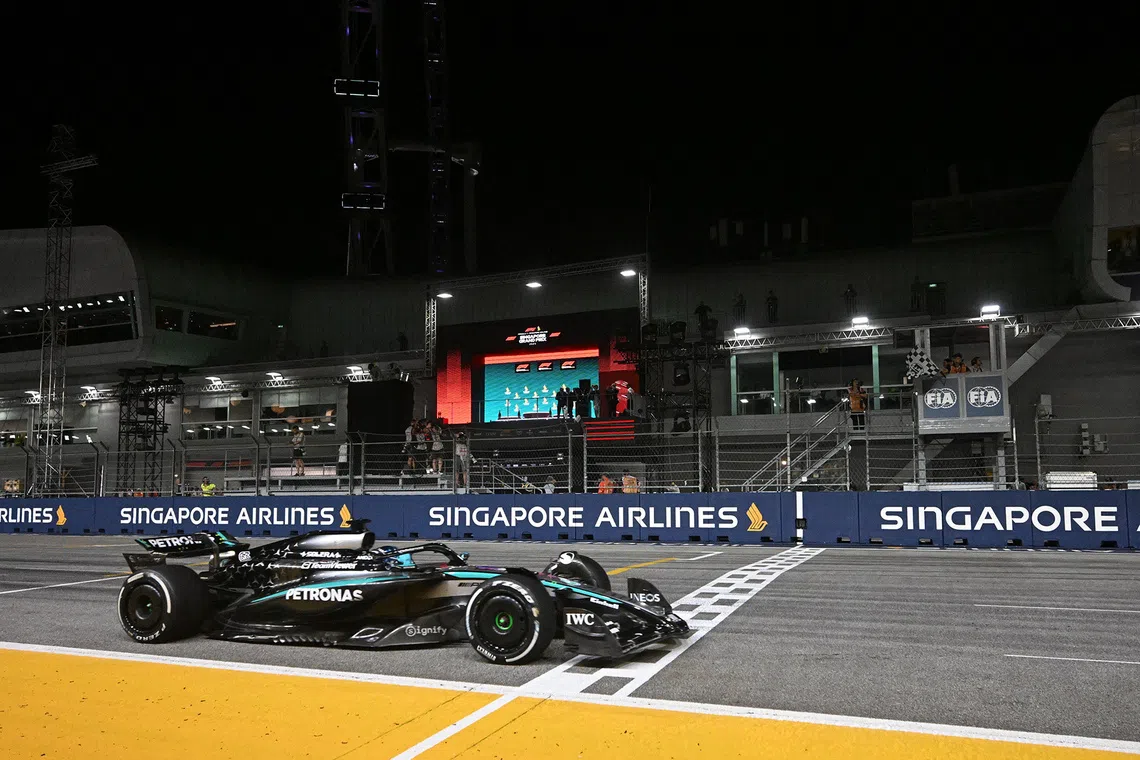 Mercedes' George Russell wins the 2025 Formula One Singapore Airlines Singapore Grand Prix at the Marina Bay Street Circuit on Oct 5, 2025. ST PHOTO: AZMI ATHNI
