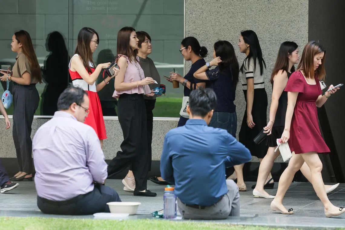 Office workers seen at Raffles Place during lunchtime on December 23, 2024.