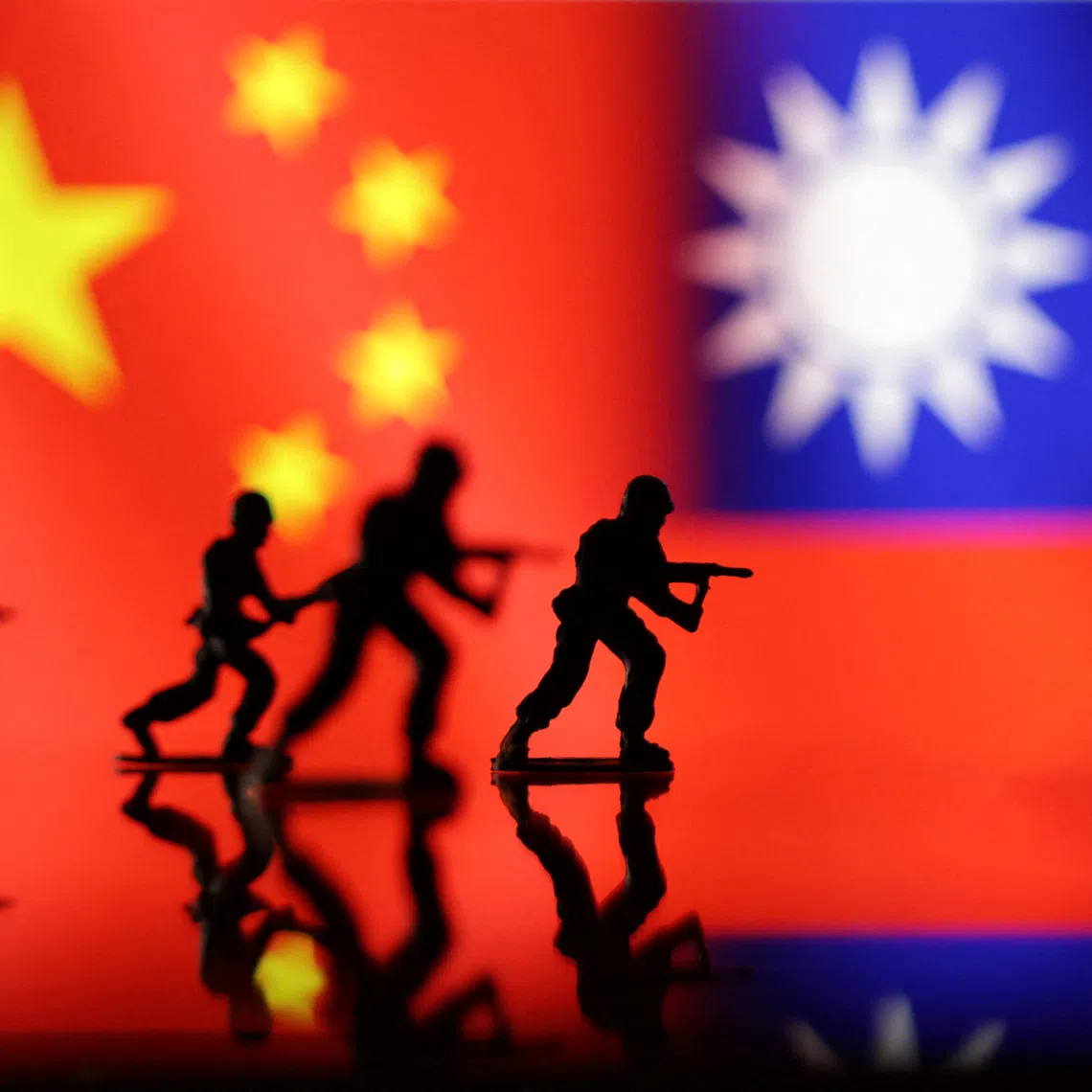 Solider miniatures are seen in front of displayed Chinese and Taiwanese flags in this illustration taken, April 11, 2023. REUTERS/Dado Ruvic/Illustration