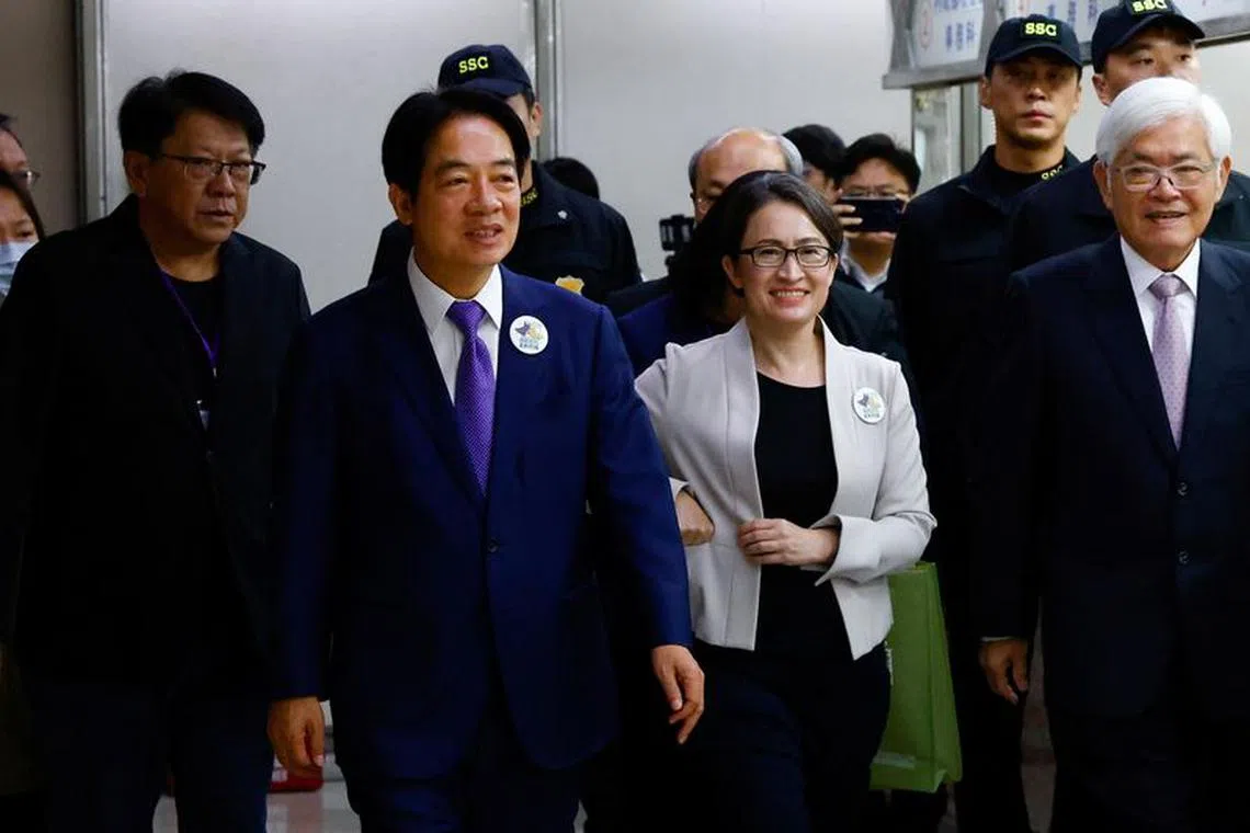 Taiwan's Vice President Lai Ching-te and his running mate Hsiao Bi-Khim arrive to register for the upcoming presidential election for the ruling Democratic Progressive Party (DPP) at the Central Election Commission in Taipei, Taiwan November 21, 2023. REUTERS/Ann Wang