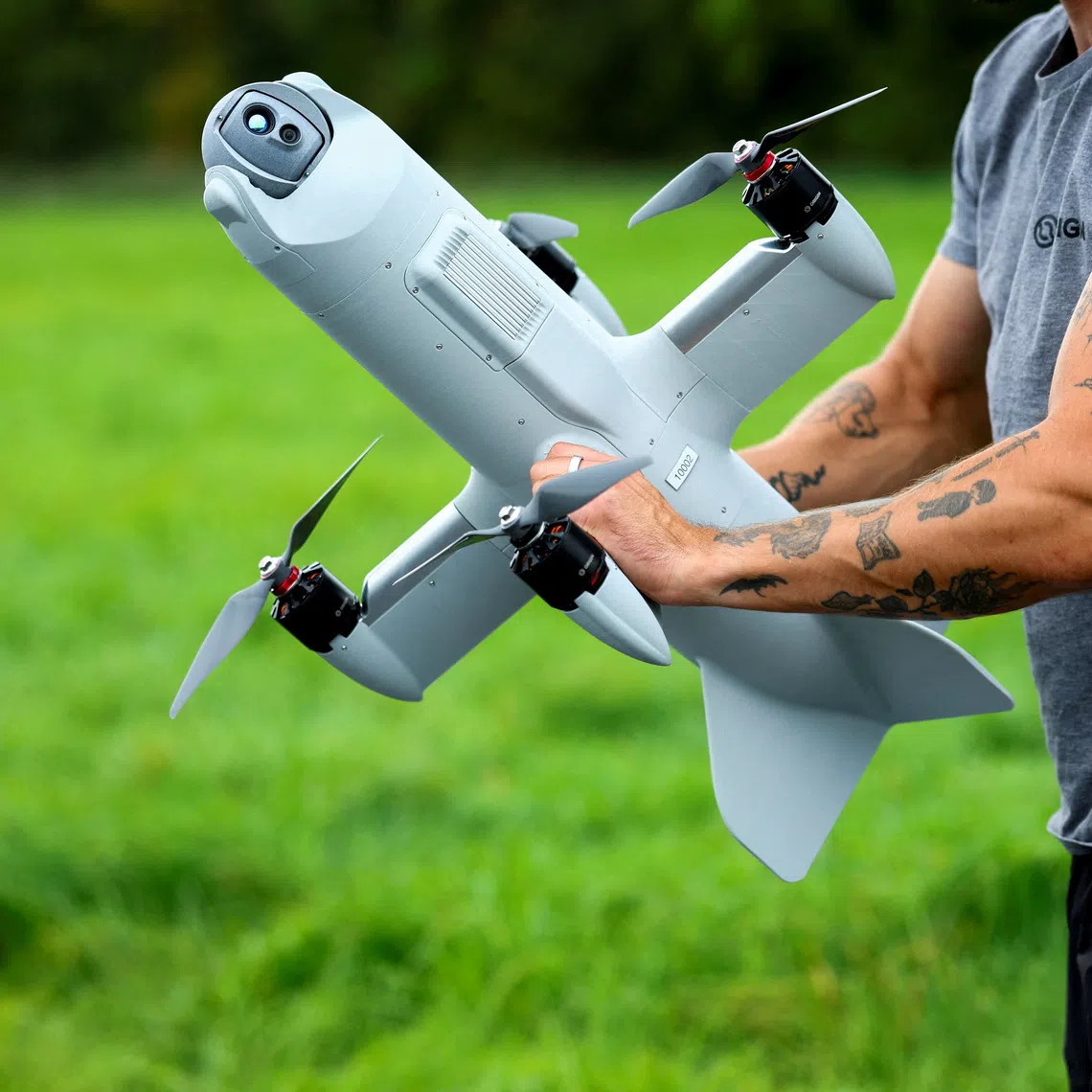 FILE PHOTO: An engineer holds a interceptor drone, while a Dutch company tests commands on the AI-powered Nexus system during flight tests with multiple drones operated from a ground force vehicle in Katwijk aan Zee, Netherlands, September 30, 2026. REUTERS/Piroschka van de Wouw/File Photo