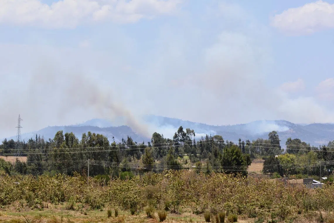 A general view shows smoke billowing from a fire that broke out during an exercise by British troops at a conservancy near Nanyuki, in central Kenya, March 26, 2021. REUTERS/Ayenat Mersie/File Photo