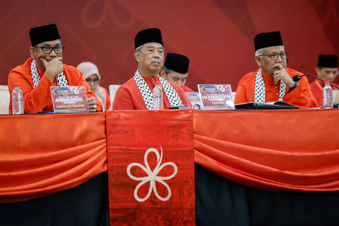Bersatu’s founding president Muhyiddin Yassin (centre) shocked many when he announced he would not defend the post, a decision he later rescinded.