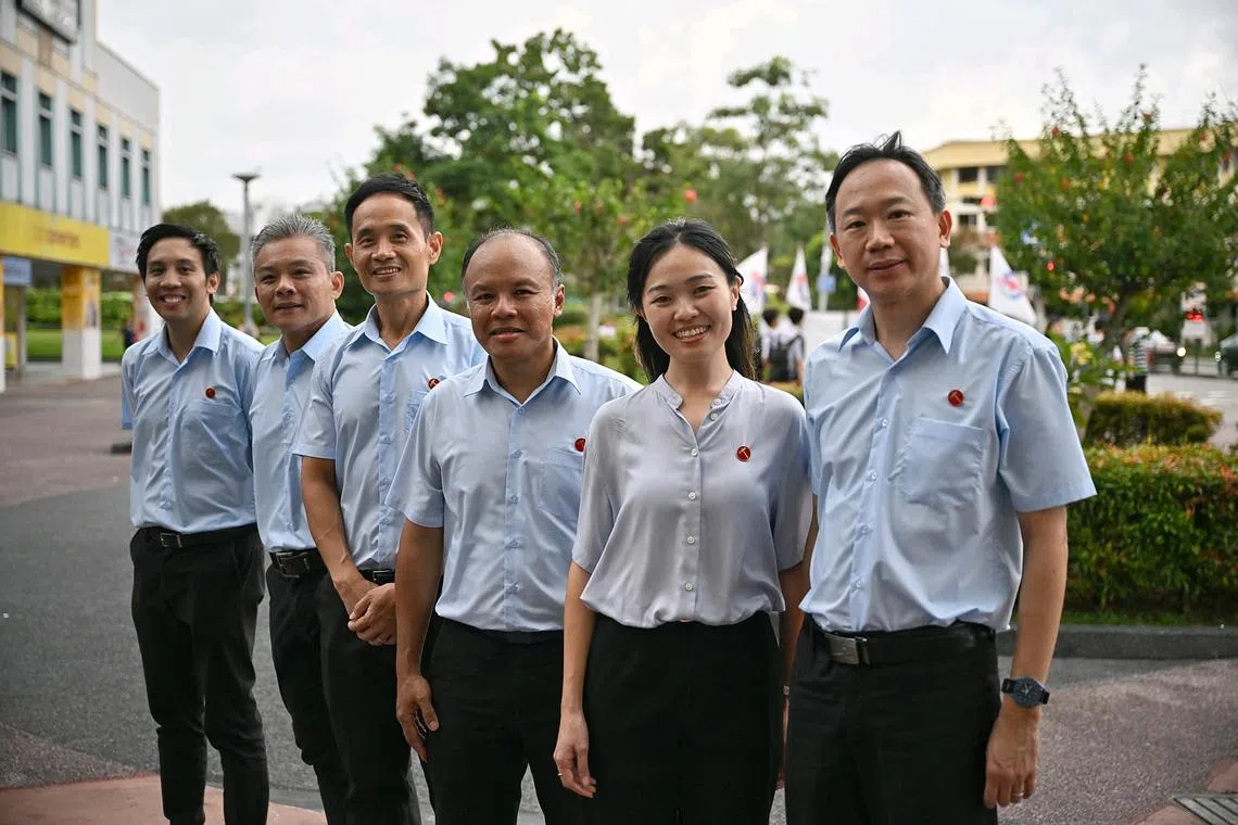 WP’s Tampines Changkat candidate Kenneth Foo (third from left) and Tampines GRC candidates (from left) Michael Thng, Jimmy Tan, Faisal Manap, Eileen Chong and Ong Lue Ping.