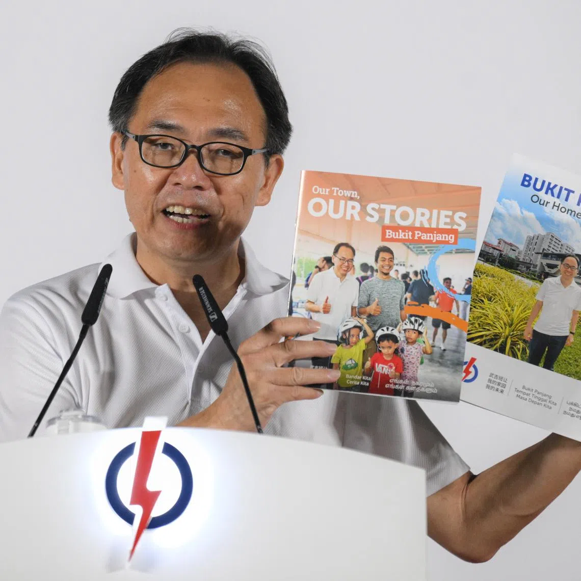 #pap PAP candidate for Bukit Panjang SMC Liang Eng Hwa shows booklets with plans for Bukit Panjang as he speaks during a rally at Beacon Primary School on April 30, 2025.