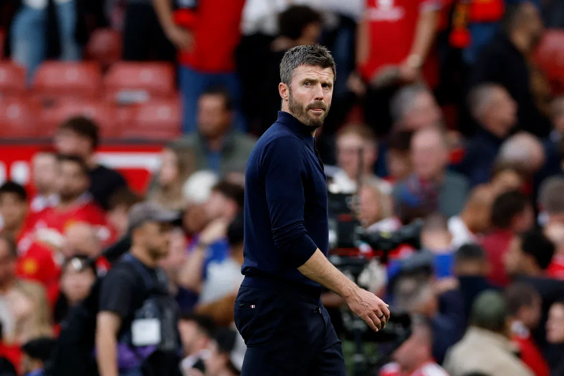 Manchester United manager Michael Carrick reacts after his side lost the match 1-0 to Manchester City at Old Trafford on Sept 13.