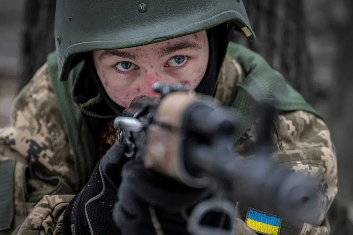 FILE PHOTO: A volunteer who aspire to join the 3rd Separate Assault Brigade of the Ukrainian Armed Forces attends basic training, amid Russia's attack on Ukraine, at an undisclosed location in the Kyiv region, Ukraine January 9, 2024. REUTERS/Viacheslav Ratynskyi/File Photo