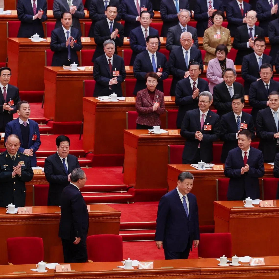 Delegates and party members applaud as Chinese President Xi Jinping arrives for the opening session of the Chinese People's Political Consultative Conference (CPPCC) at the Great Hall of the People in Beijing, China March 4, 2026. REUTERS/Maxim Shemetov
