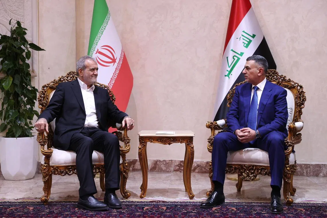 Iranian President Masoud Pezeshkian (left) talks to Basra governor Assad Al Amin in the city of Basra, Iraq, on Sept 13, 2024.