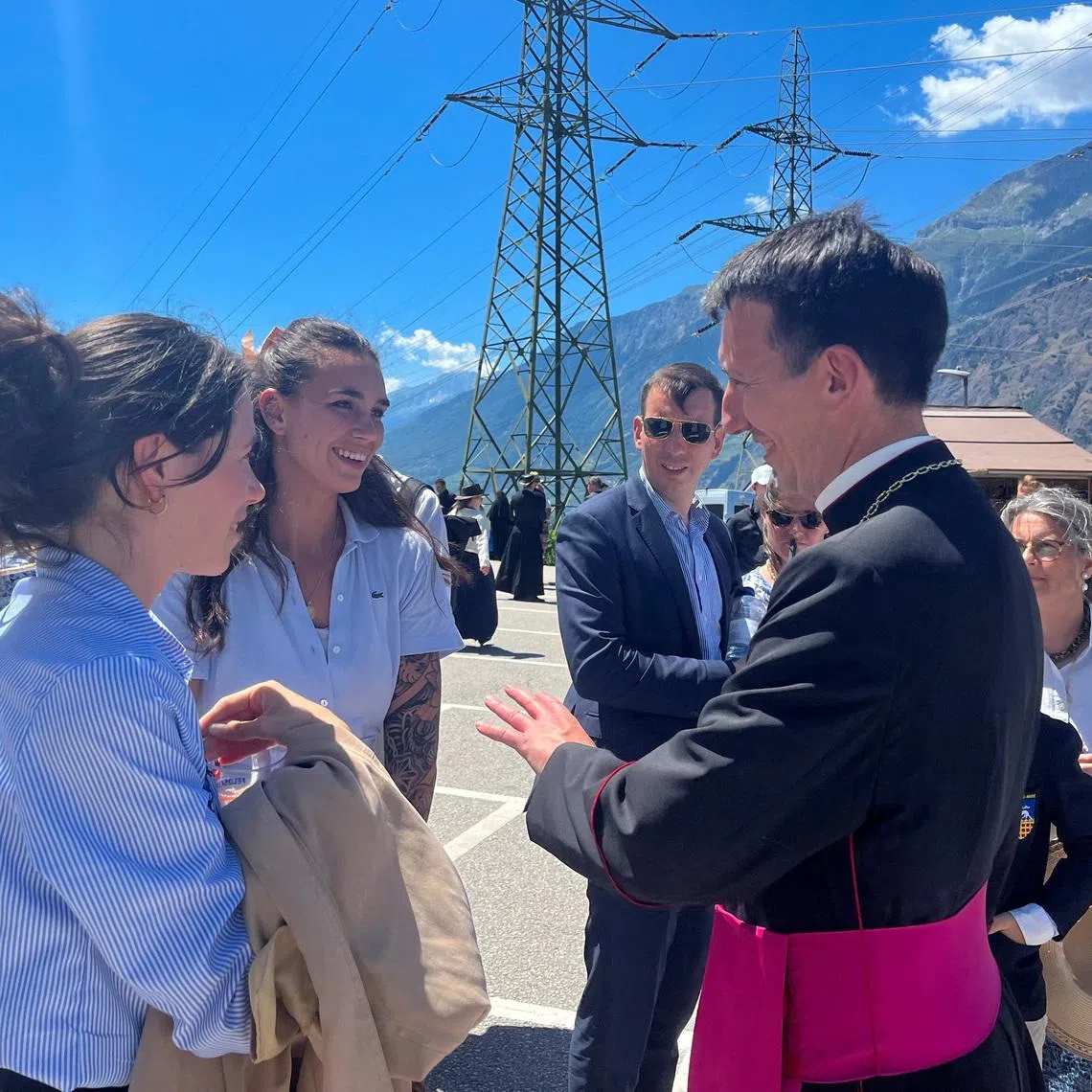 Michel Poinsinet de Sivry, one of the newly-ordained bishops of the Swiss-based Society of Saint Pius X, greets people in Econe, Switzerland, July 2, 2026. REUTERS/Emma Farge