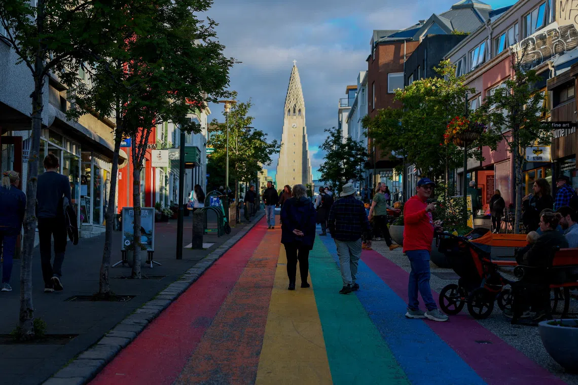 FILE PHOTO: People walk on Rainbow Street ahead of a referendum on whether Iceland should resume accession negotiations with the European Union, in Reykjavik, Iceland, August 10, 2026. REUTERS/Denis Balibouse/File Photo
