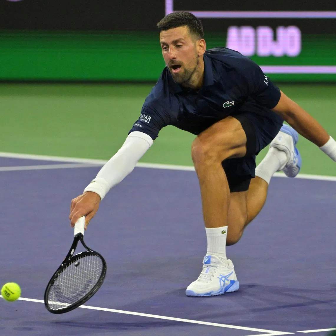 Mar 11, 2026; Indian Wells, CA, USA;  Novak Djokovic (SRB) reaches for a drop shot during his fourth round match against Jack Draper (GBR) in the BNP Paribas Open at the Indian Wells Tennis Garden. Mandatory Credit: Jayne Kamin-Oncea-Imagn Images