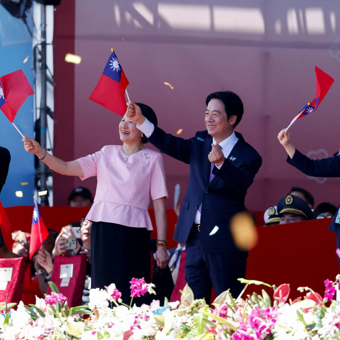 Taiwan President Lai Ching-te waves a Taiwan flag with his wife Taiwan's First Lady Wu Mei-ju on the day he delivers a speech during National Day celebrations in Taipei, Taiwan, October 10, 2025. REUTERS/Ann Wang