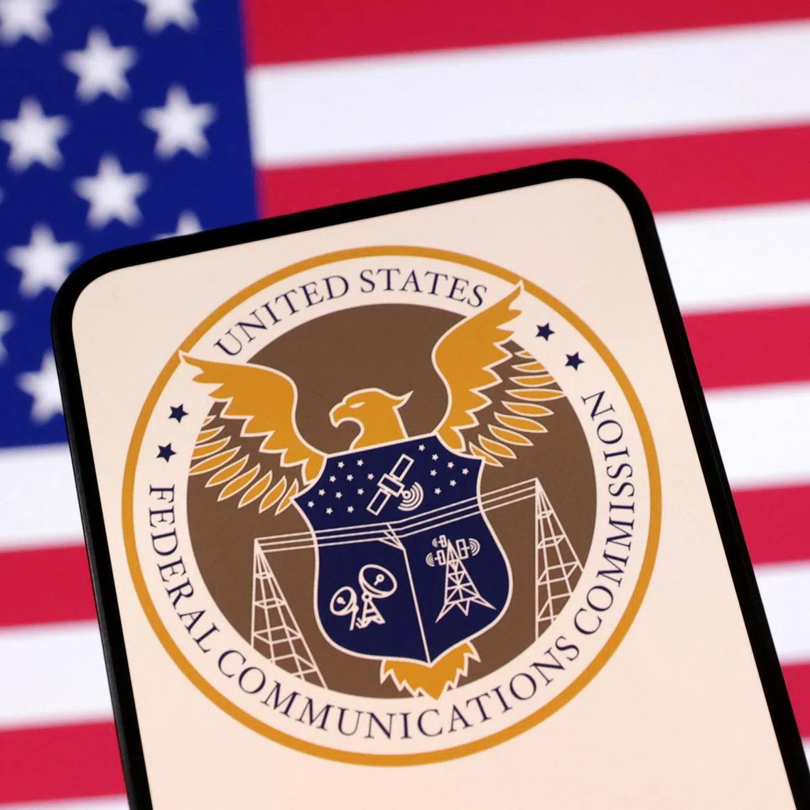 United States Federal Communications Commission logo and U.S. flag are seen in this illustration taken April 23, 2025. REUTERS/Dado Ruvic/Illustration