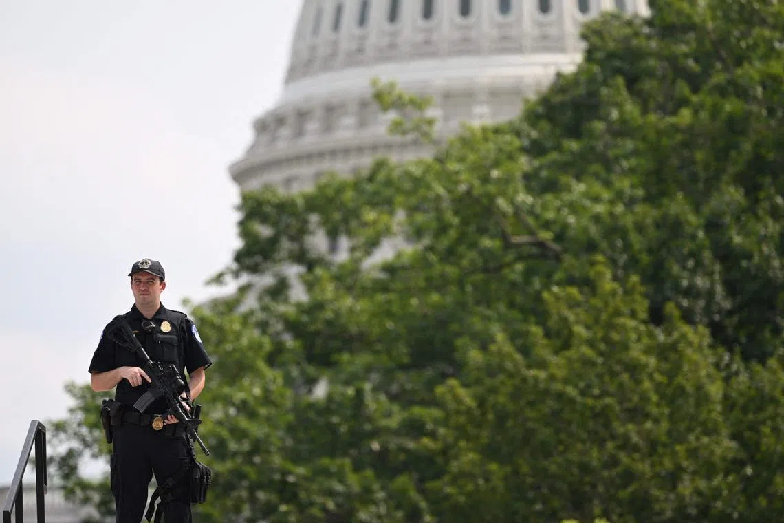 A US Capitol police officer stands guard near the Capitol building.