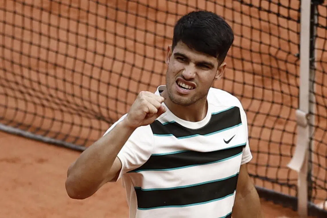 epa12149777 Carlos Alcaraz of Spain celebrates after winning his Men's 4th round match against Ben Shelton of USA at the French Open Grand Slam tennis tournament at Roland Garros in Paris, France, 01 June 2025. EPA-EFE/YOAN VALAT