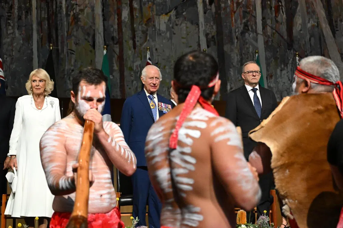 Britain's King Charles III (centre) and Queen Camilla (left) observe Aboriginal dancers as they attend a Parliamentary reception hosted by Australian Prime Minister Anthony Albanese and partner Jodie Jaydon at Parliament House in Canberra.