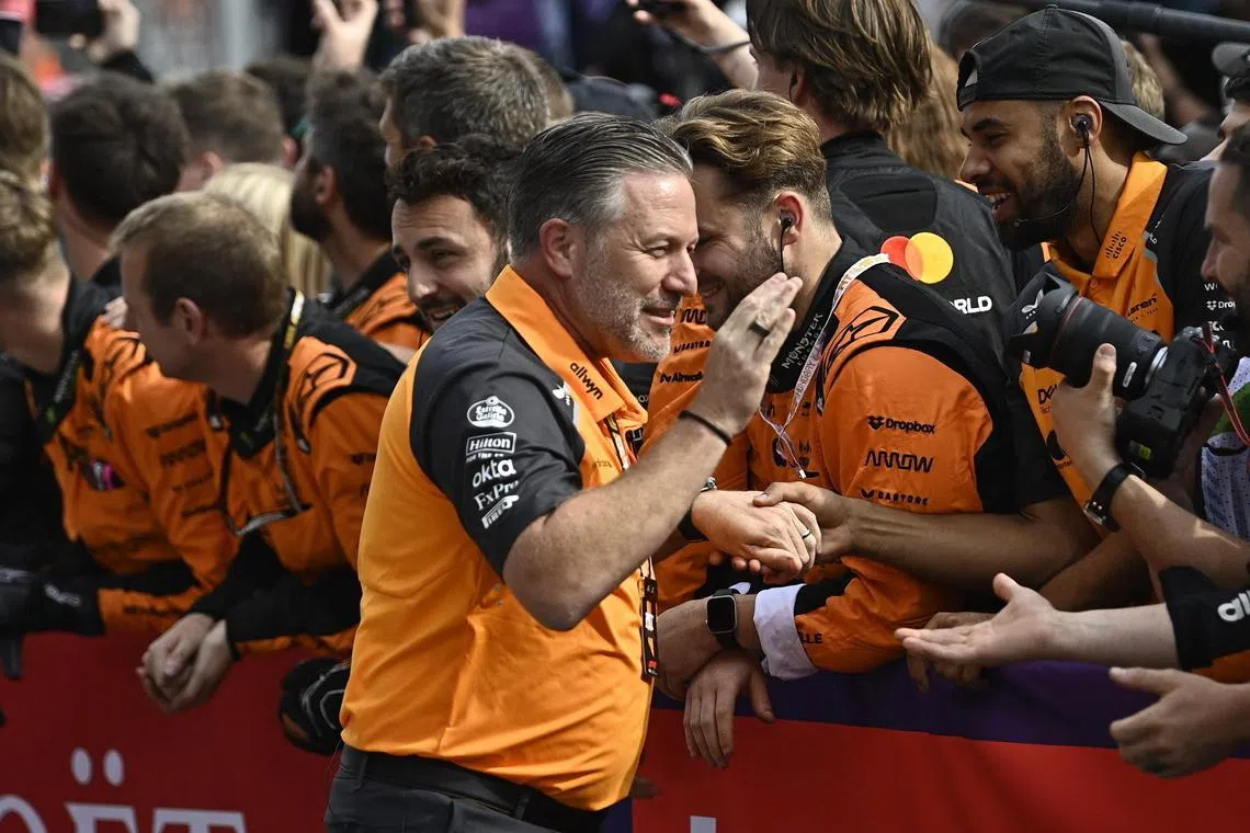 CEO of McLaren Zak Brown celebrates with the team after driver Lando Norris won the Hungarian Grand Prix.