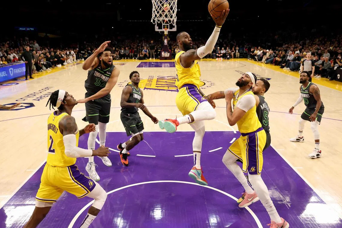 Los Angeles Lakers star LeBron James scores on a layup in the 108-102 overtime win over the Minnesota Timberwolves.