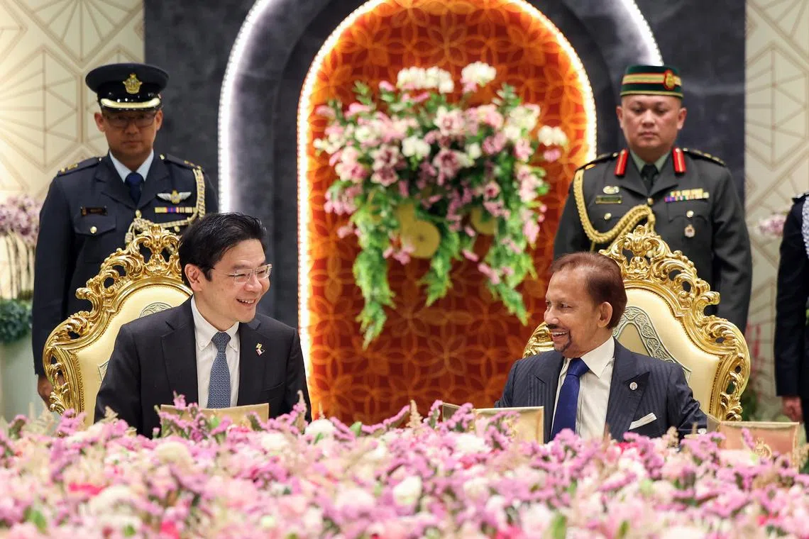 PM Lawrence Wong (left) at lunch with Brunei Sultan Hassanal Bolkiah in Brunei on Nov 3, 2025.