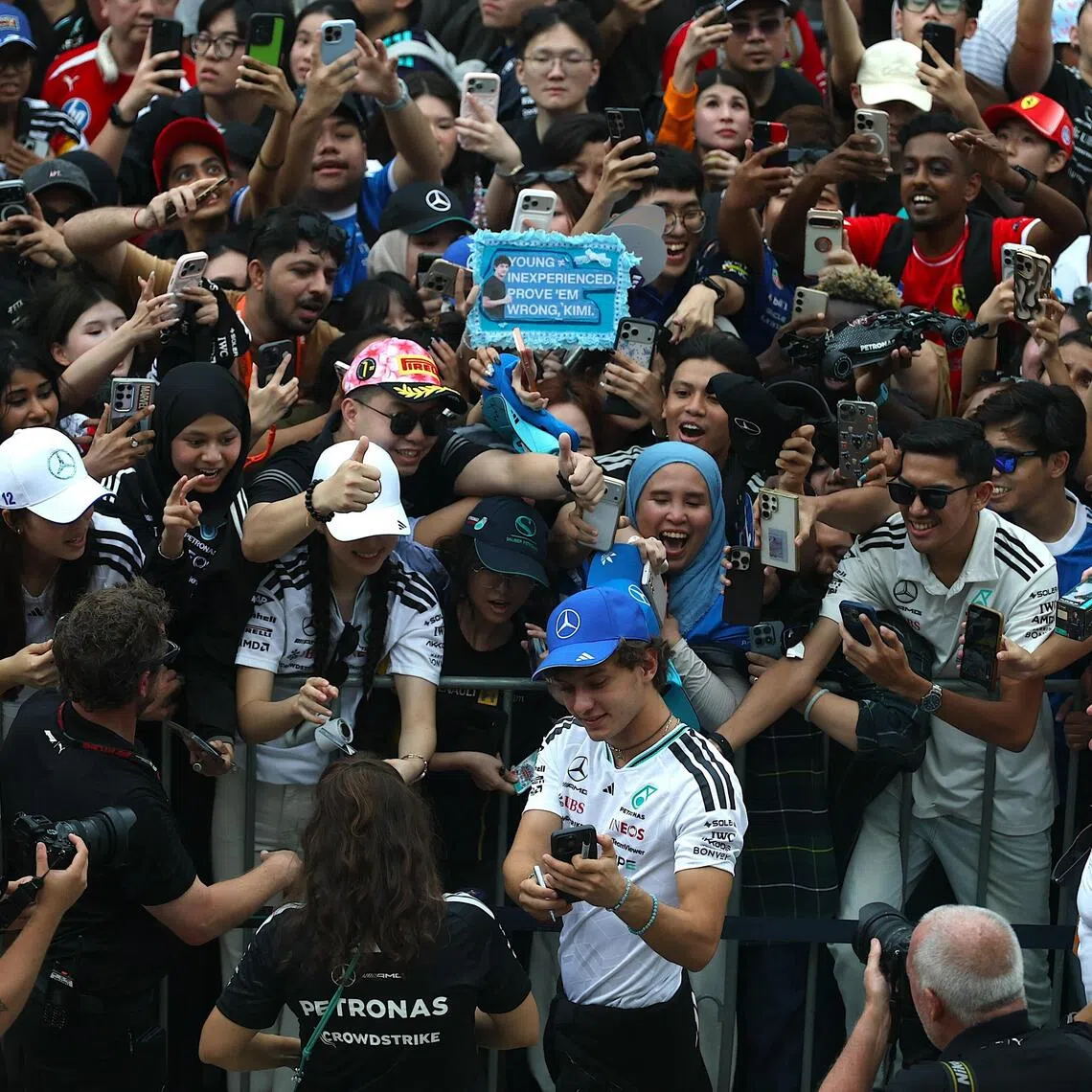 Mercedes’ Italian driver Andrea Kimi Antonelli taking a wefie with fans at the Formula 1 Bahrain Grand Prix in Malaysia, in Sepang, on Oct 1. The championship leader is raring to bounce back after fifth place in Baku, Azerbaijan last weekend.