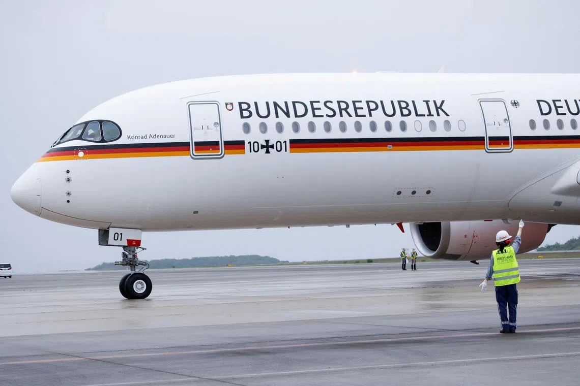 FILE PHOTO: The plane carrying German Chancellor Olaf Scholz arrives at Hiroshima airport, ahead of the G7 leaders' summit in Mihara, Hiroshima, Japan May 18, 2023. REUTERS/Androniki Christodoulou/File Photo