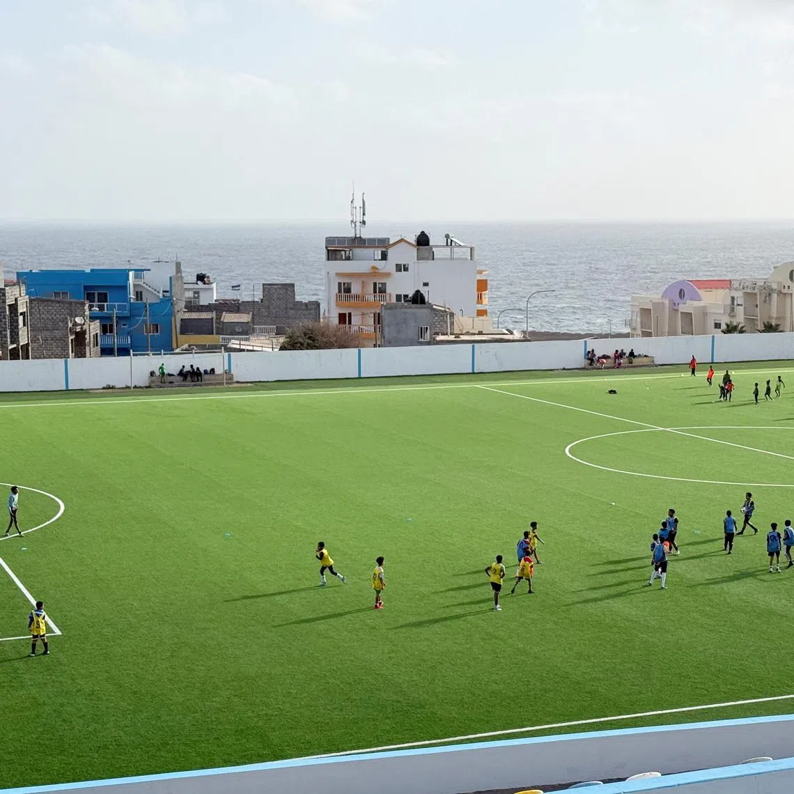 People play football in the town of Ponta do Sol on the island of Santo Antao, Cape Verde, March 7, 2026. Picture taken with a mobile phone. REUTERS/Simon Robinson