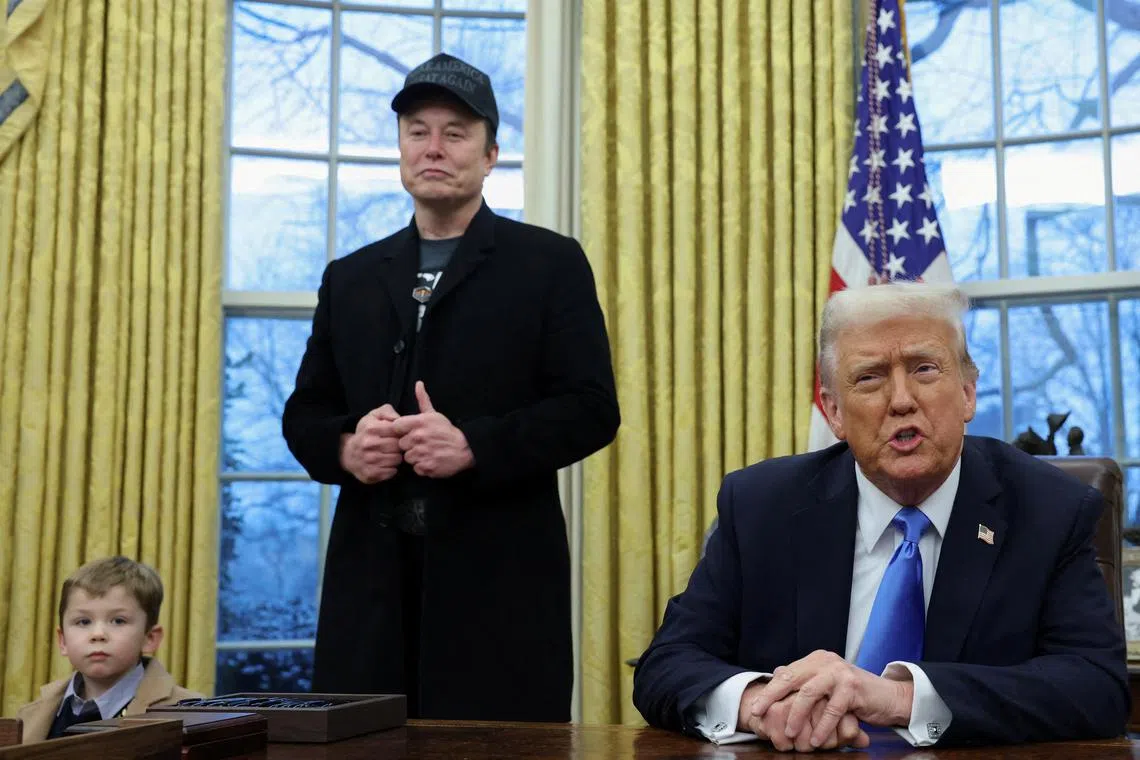 US President Donald Trump (right) and Mr Elon Musk, in the Oval Office of the White House in Washington, on Feb 11.