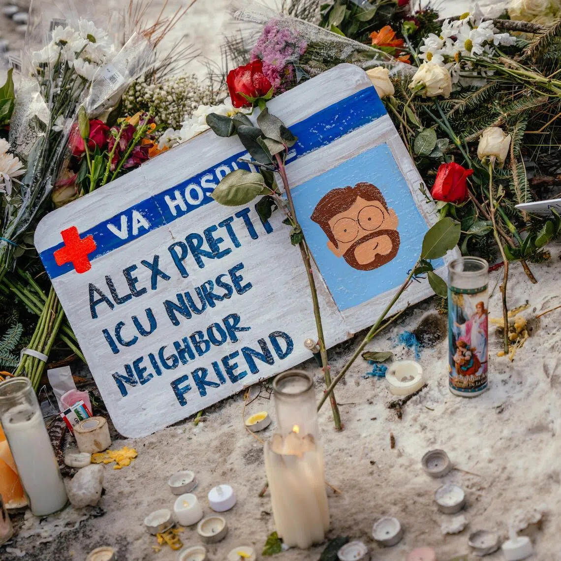 A handmade sign left in memory of Alex Pretti, the man fatally shot by federal agents, near the spot where it happened the previous day, in Minneapolis, Jan. 25, 2026. 