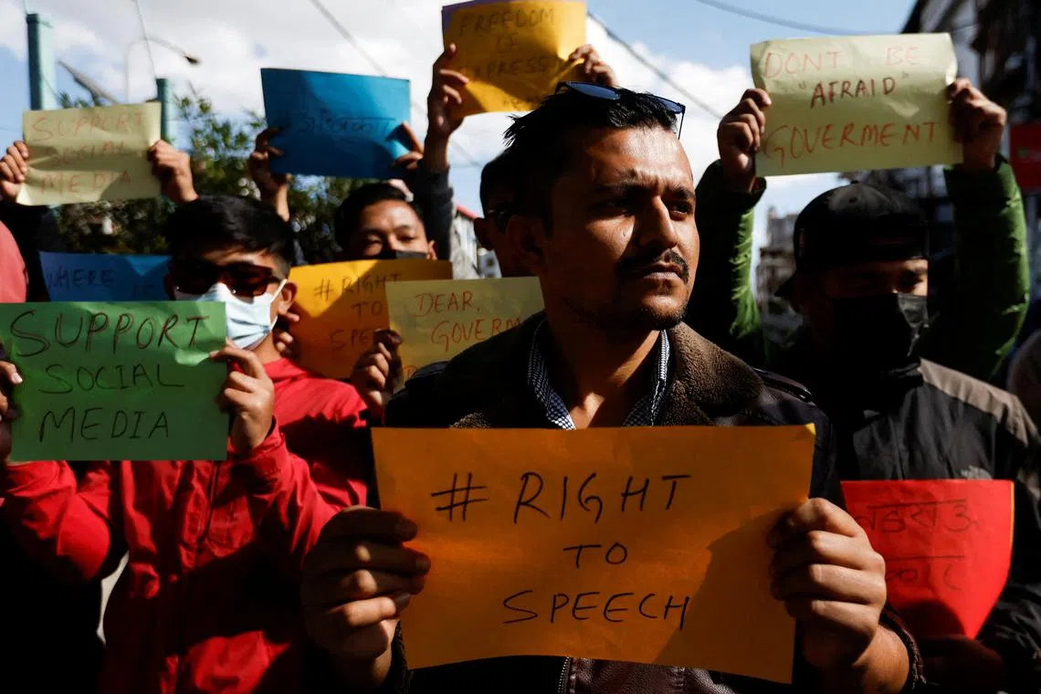 FILE PHOTO: Participants holding placards take part in a protest against the ban on TikTok in Kathmandu, Nepal November 18, 2023. REUTERS/Navesh Chitrakar/File Photo