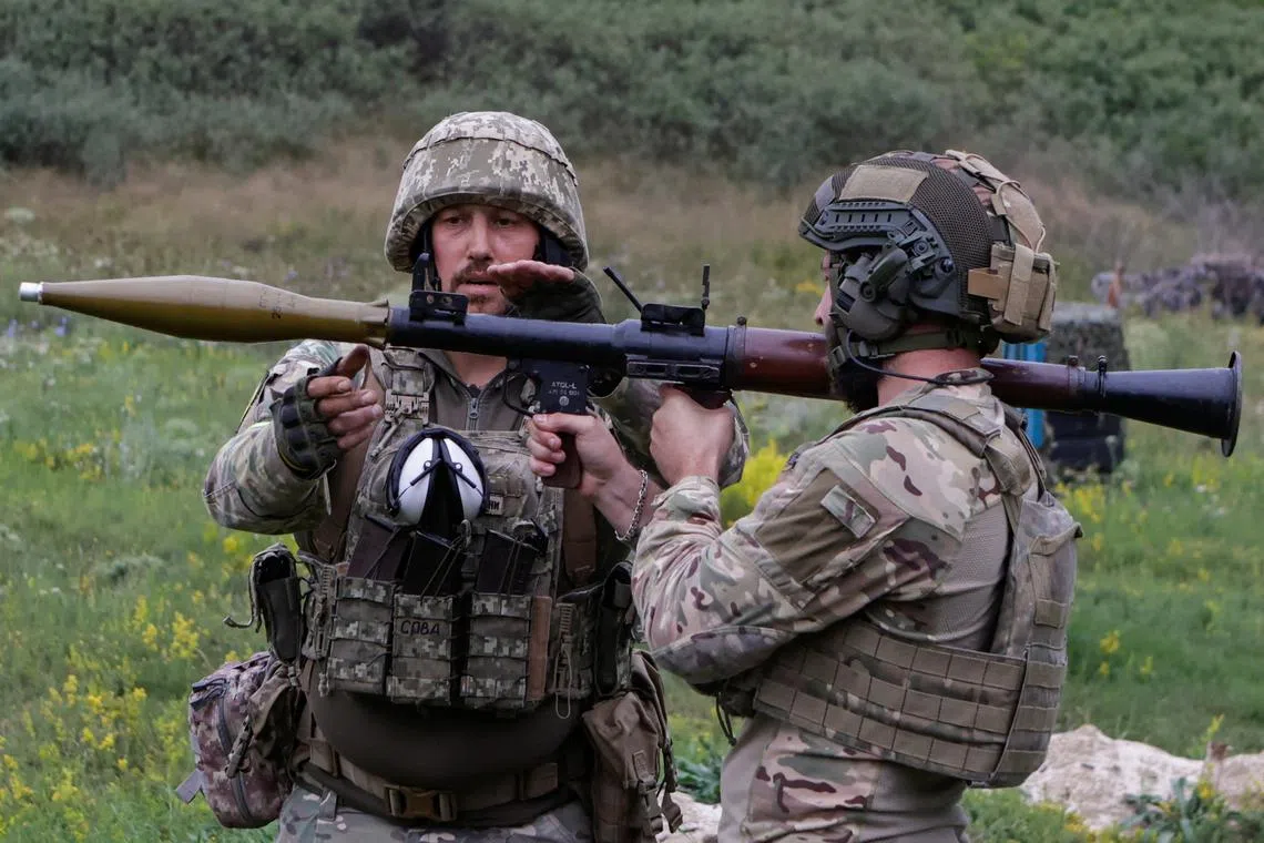 FILE PHOTO: Service members of the 58th Separate Motorized Infantry Brigade of the Ukrainian Armed Forces use an RPG-7 grenade launcher during military exercises at a training ground, amid Russia's attack on Ukraine, in Kharkiv region, Ukraine August 11, 2025. REUTERS/Sofiia Gatilova/File Photo