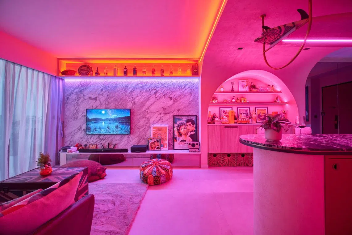 High-impact lighting from hidden LED strip lights changes the mood of the home of  Leon Luo and Gwen Chiong in an instant for maximalist effect. 