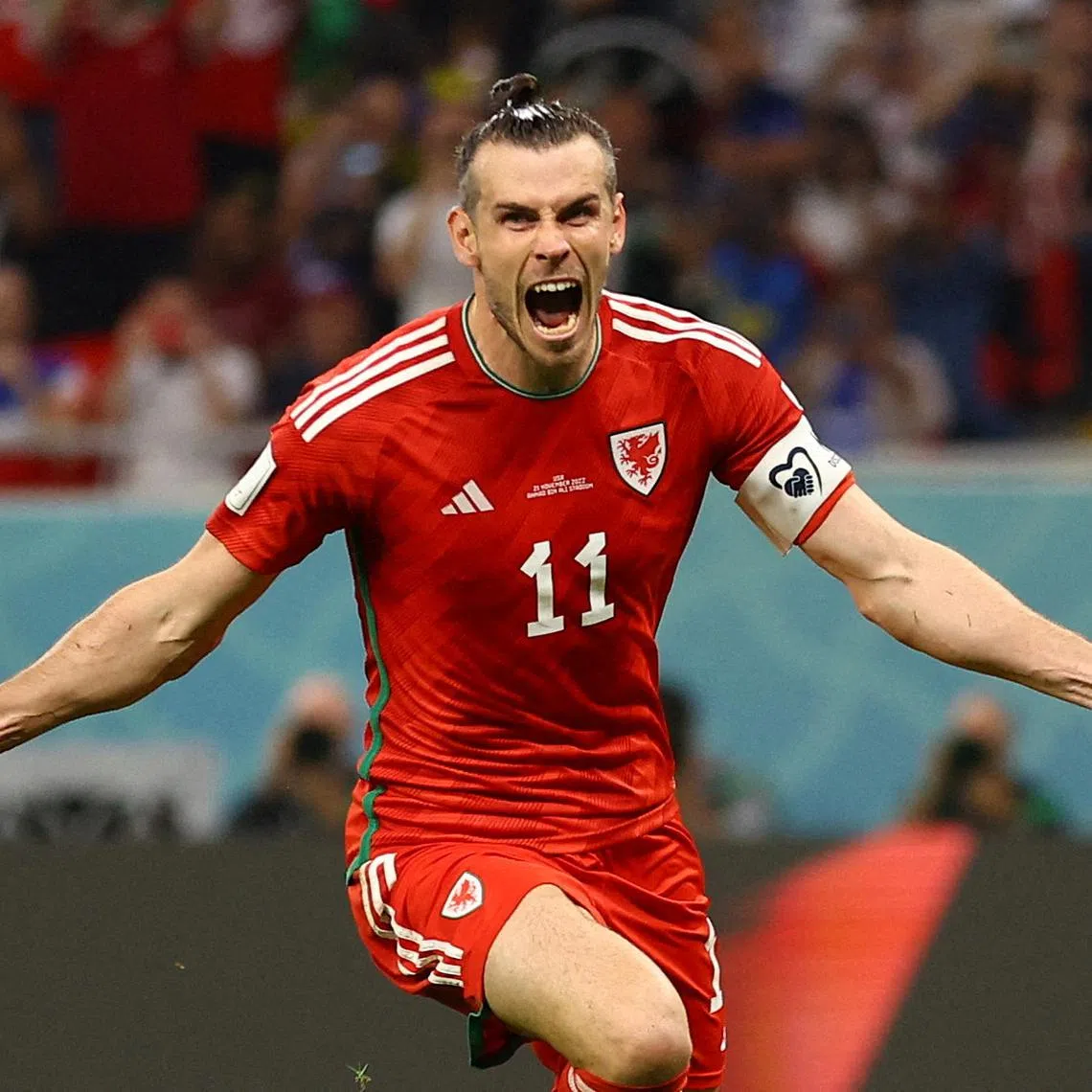 Soccer Football - FIFA World Cup Qatar 2022 - Group B - United States v Wales - Ahmad Bin Ali Stadium, Al Rayyan, Qatar - November 21, 2022  Wales' Gareth Bale celebrates scoring their first goal REUTERS/Hannah Mckay